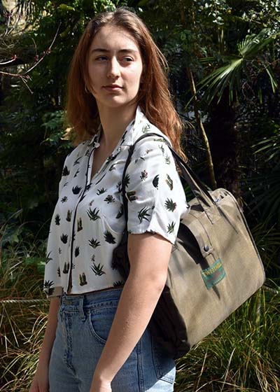 Woman wearing a picnic blanket